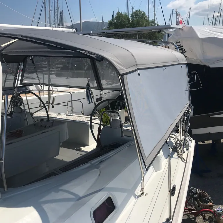 Bimini and cockpit enclosure fitted together on a sailing yacht