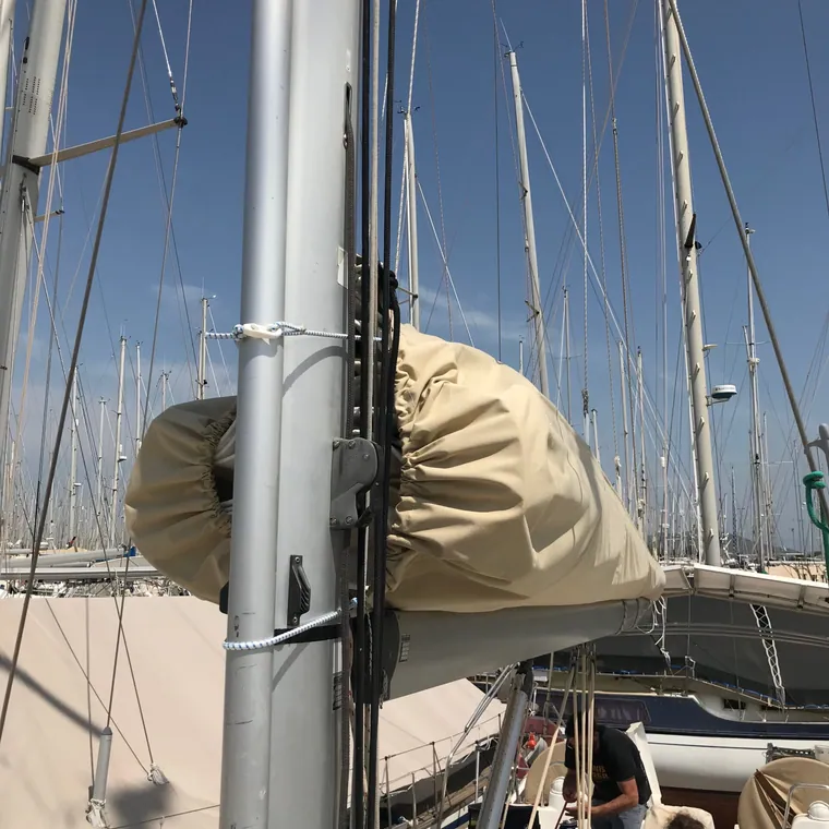 Tan lazy bag seen from the mast looking aft along the boom