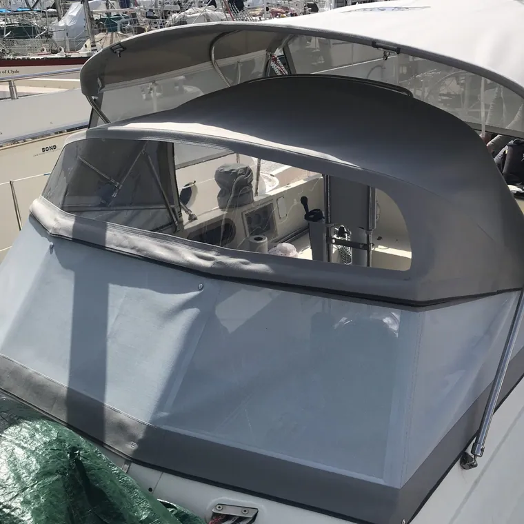 Grey sprayhood on a yacht ashore in the yard
