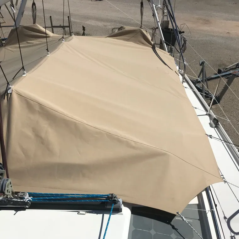 Tan winter cover tented over the cockpit and coachroof of a yacht