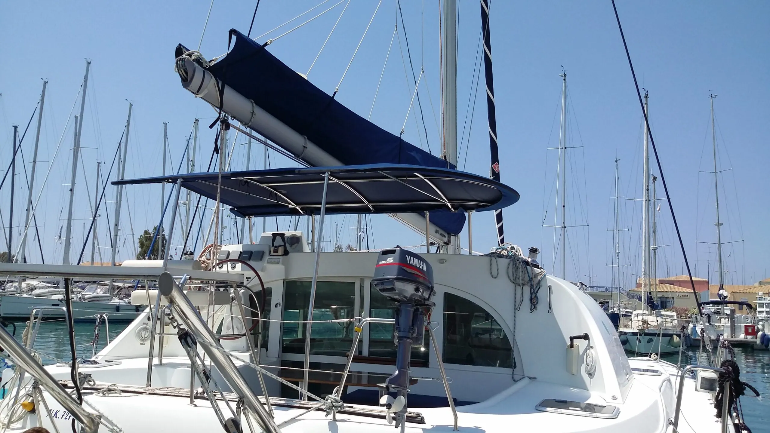 A bimini rigged over the cockpit of a catamaran