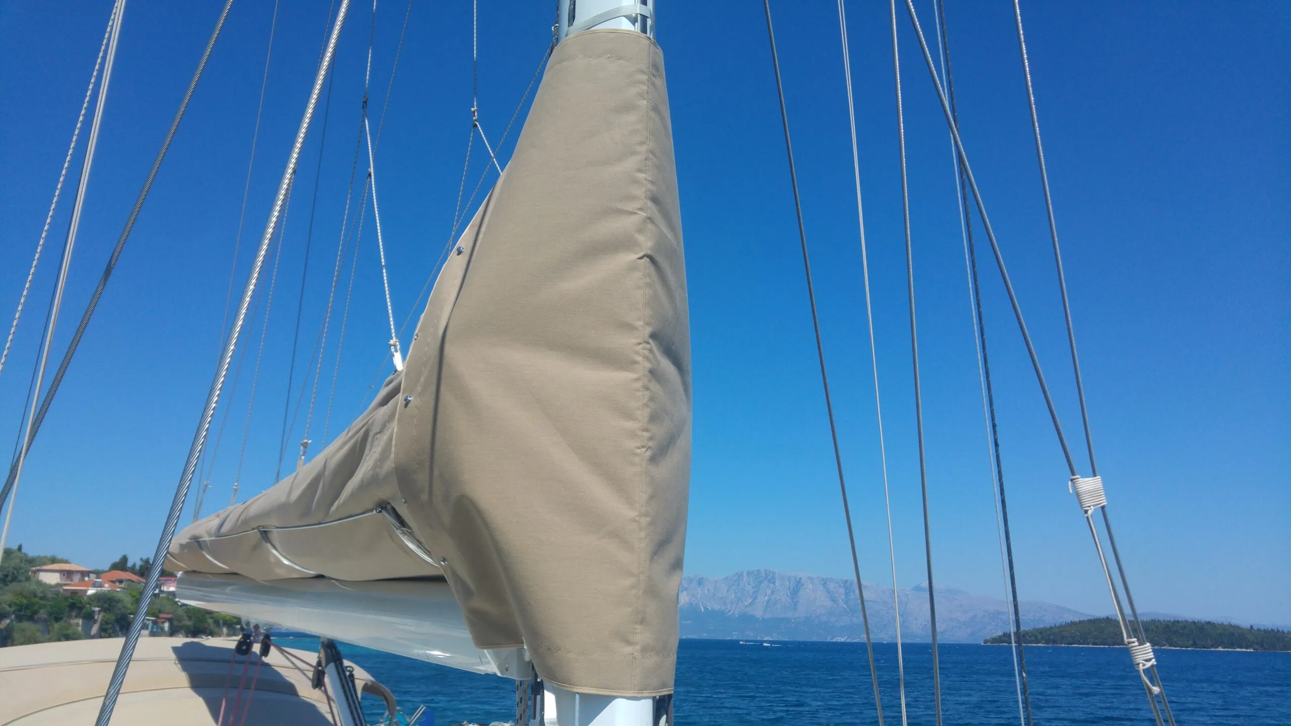 Canvas work on a yacht, open sea beyond