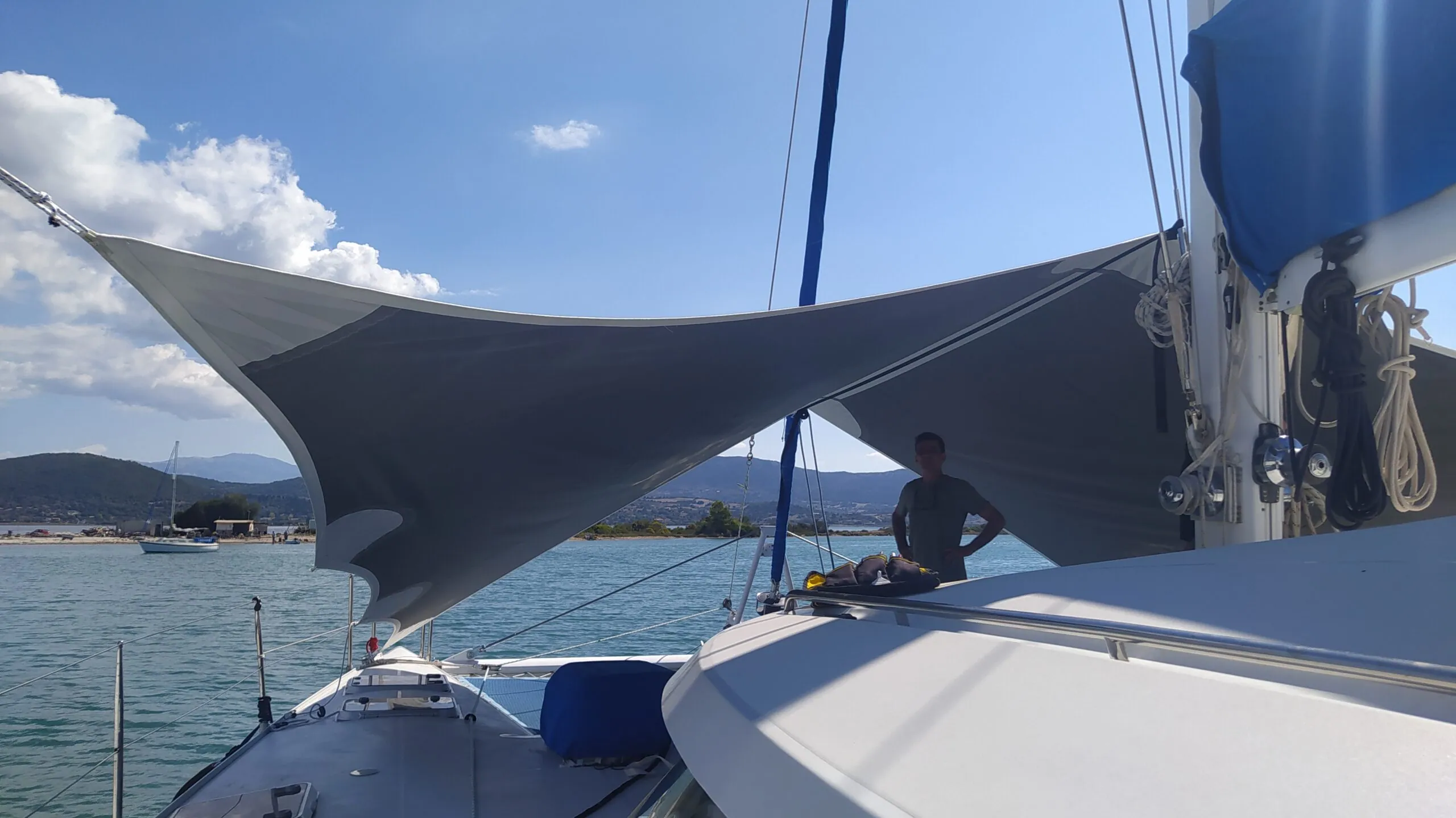 A shade sail tensioned over the deck of a yacht